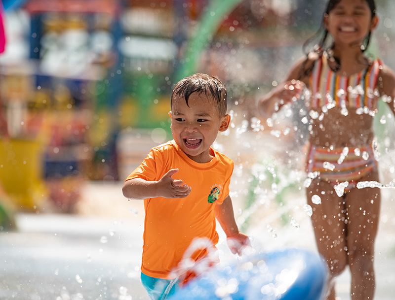 Child having a blast on kiddie slide