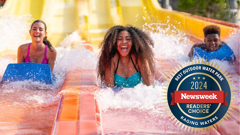 Group racing down slide